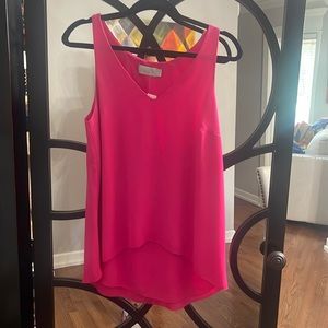 Hot pink tank top. Hi/lo designed hemline